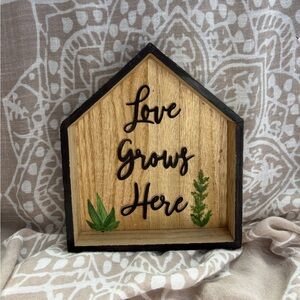 Rustic Wooden Wall Decor with Black Trim “Love Grows Here”